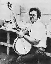 Don Thomas displaying the product of his banjo craft.